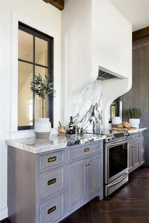 Gray Wash Kitchen Cabinets With Vintage Brass Pulls Transitional