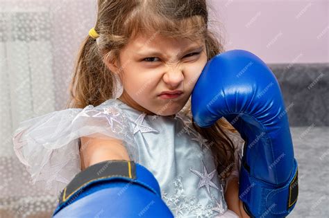 Premium Photo Little Girl Wearing Blue Boxing Gloves And A Holiday