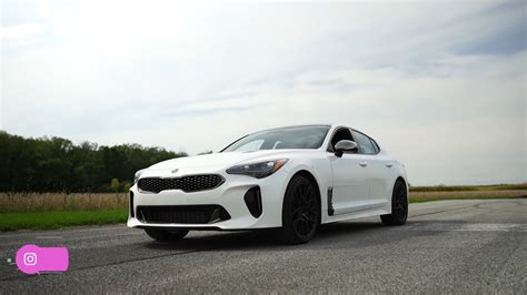 Drag Battle Kia Stinger Gt With A Tune Messes With A Roush Ford Mustang Gt