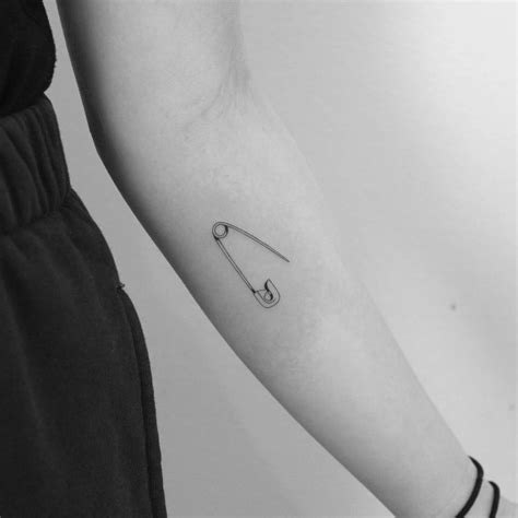 Fine Line Safety Pin Tattoo Located On The Inner