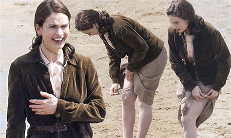 Lily James Pulls Up Stockings On Guernsey Set Daily Mail Online