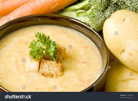 Potato Soup With Carrots And Broccoli Topped With Fresh Parsley And