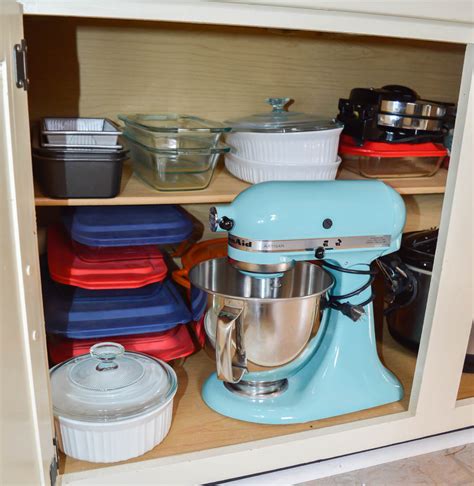appliances pots pans kitchen organizing organization organized pot cabinet stored which mixer front
