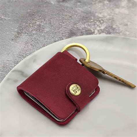 Life often takes us in many different directions. personalised leather photo book keyring by hold upon heart ...