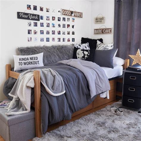 A Bed Room With A Neatly Made Bed And Lots Of Decorations On The Wall