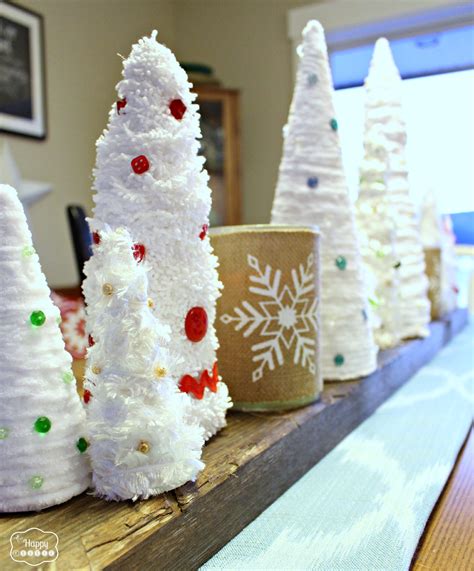 Easy Thrifty Diy Mini Christmas Trees With Yarn And Feathers The