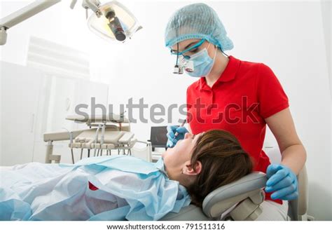 Doctor Dentist Treats Teeth Female Patient Stock Photo 791511316