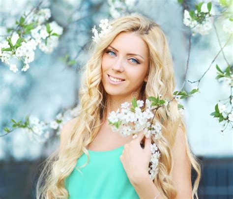 Spring Portrait Of A Beautiful Young Woman In Flowering Stock Image