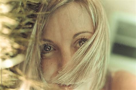 Woman Laying In The Grass With Part Of Her Hair Over Her Face By Stocksy Contributor Carolyn