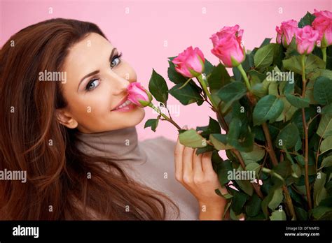 Beautiful Woman Smelling A Rose Stock Photo Alamy