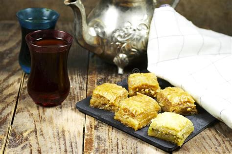 Pistachio Baklava Dessert With Teapot On Wood Table Traditional