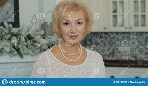 Elderly Beautiful Woman Smiling Looking At The Camera Portrait Of