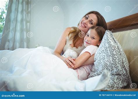 Mother Lying With Daughter On Bed Stock Image Image Of Happy