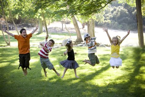 Kids Jumping Outside On A Sunny Day Ecology Sunny Days Float Soccer