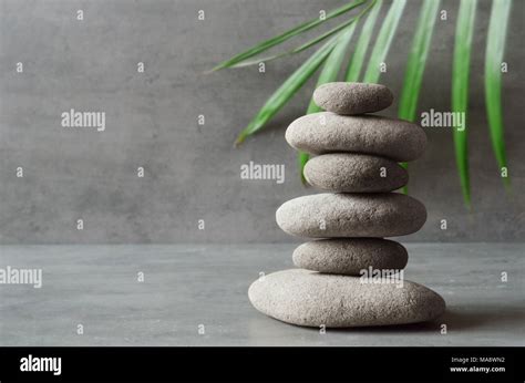 Stones And Green Palm Leaf Balance Zen And Spa Concept Stock Photo Alamy