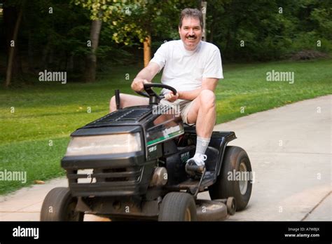 Man Sitting On Lawn Mower Hi Res Stock Photography And Images Alamy