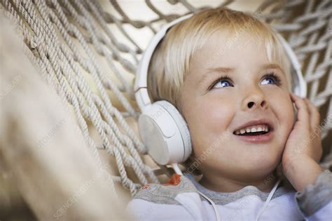 A Child Wearing Headphones Stock Image F0088669 Science Photo