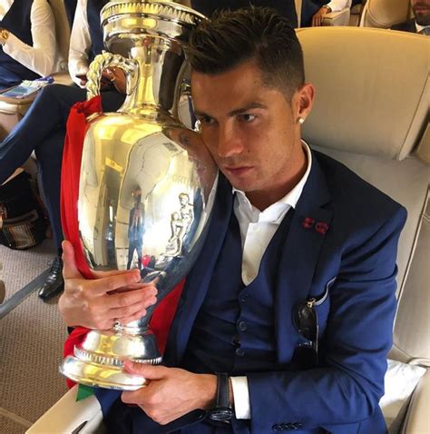 Cristiano Ronaldo Cuddles The Cup As Portugal Fly Home From Their Euro 2016 Triumph Mirror Online