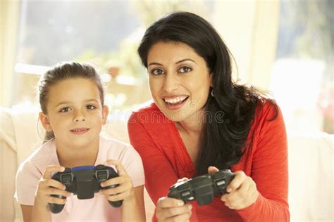 Mother And Daughter Playing Video Game At Home Stock Image Image Of