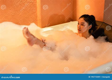 Woman Taking A Bubble Bath In Bathtub At The Night Stock Image Image