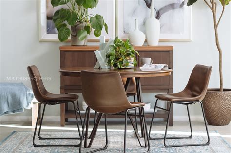 Table and chairs play roles as centerpiece and gathering space used by everyone in house. Five-Piece Mid-Century Modern 45'' Round Dining Set in ...