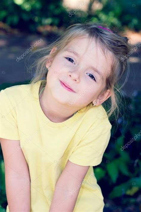 Little Girl Smiling At Camera Outdoor — Stock Photo © Nys 53188943
