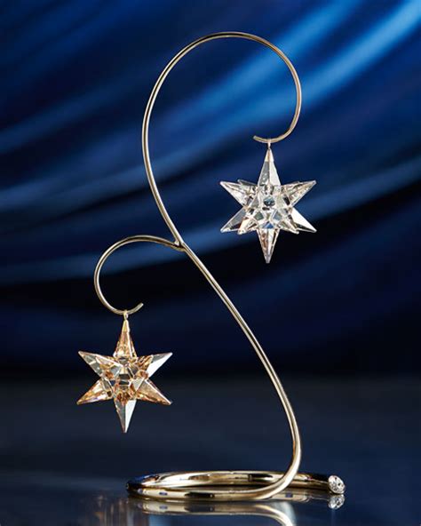 Product dimension:13.5*13.5*20 15 hooks for hanging ornament some assembly required. Swarovski Christmas Ornament Stand