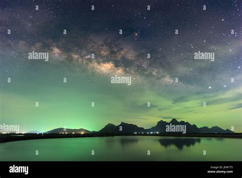 Beautiful Night Starry Sky With Rising Milky Way Over The Mountain