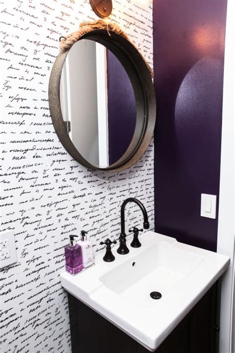 A white vanity and neutral wall trim prevent the hue from becoming too heavy. 393 West 49th Street | Bathroom wallpaper purple, Bathroom wallpaper, Purple walls