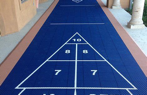 Both players should now proceed to the opposite end of the shuffleboard, where the weights are now resting. VersaCourt | Outdoor Shuffleboard Court Photos