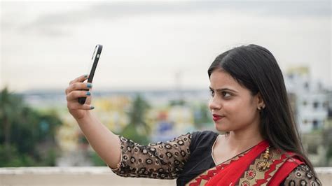 Premium Photo Beautiful Indian Girl Taking Selfie On Her Mobile Phone