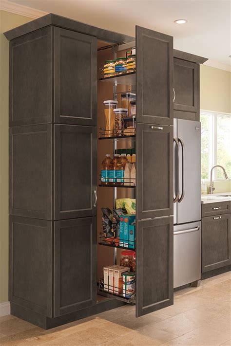 It consisted of 5 shelves, two of which held drawers (a smaller upper drawer and a larger bottom drawer). Thomasville - Organization - Tall Pantry Pull Out Cabinet