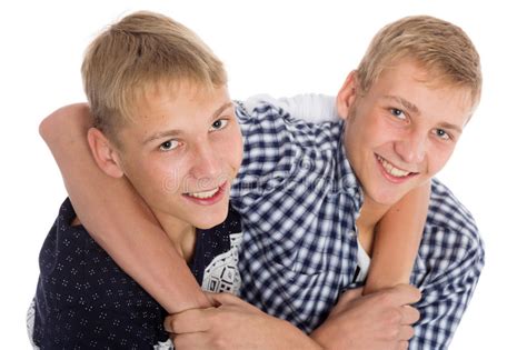 Twin Brothers Jokingly Hugging Each Other Stock Image
