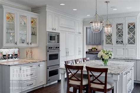 For example, paired with dark gray or even black countertops or floors, white kitchen cabinets can help create a stylish visual contrast. Houzz Features Traditional White Kitchen by Drury Design ...