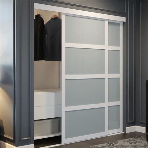 An Open Closet With White Sliding Doors And Grey Walls
