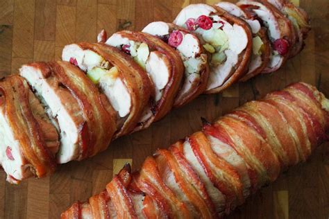 Bacon Wrapped Pork Tenderloin Stuffed With Sausage And Cranberries