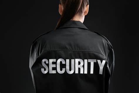 Female Security Guard In Uniform On Dark Background Closeup Patronus
