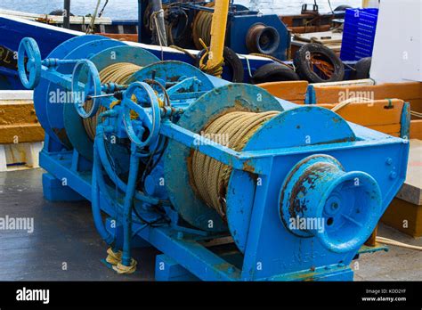 Heavy Duty Winches And Cables On The Deck Of A Commercial Fishing