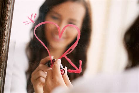 Valentines Woman Drawing Heart On Bathroom Mirror In Lipstick Del