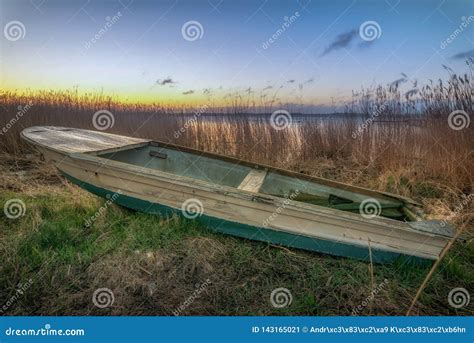 A Rowing Boat Lies In The Reeds Ashore Stock Image Image Of Nature