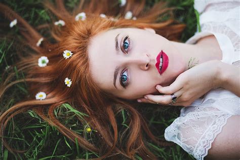 Portrait Of A Ginger Girl Laying On Grass By Stocksy Contributor Jovana Rikalo Stocksy