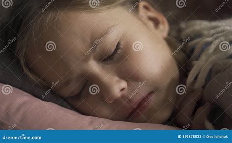 Close Up Face Of Sick Caucasian Girl Coughing While Lying Under Blanket