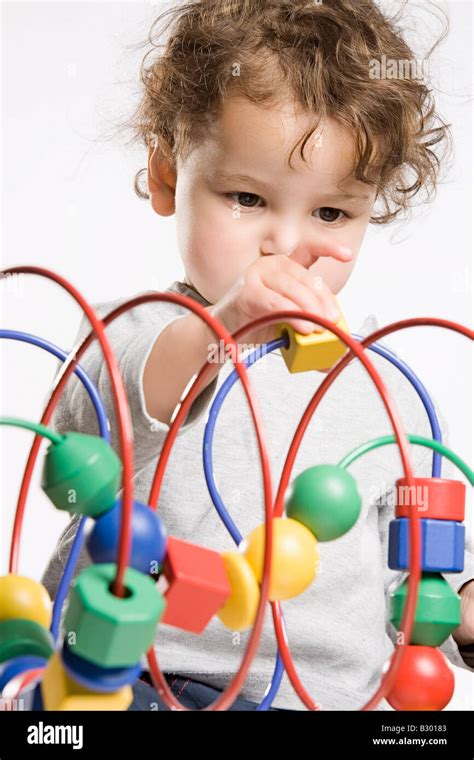 Little Girl Playing With Toy Stock Photo Alamy