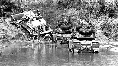 Rhodesian Eland Armoured Cars Struggle To Scale The Slippery Banks Of