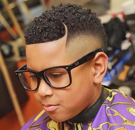 This cool cut for black hair extends the hairline into an arced part that also divides long hair from some of the best the best products for black men's hair. 25 best african american boy hairstyles images on ...
