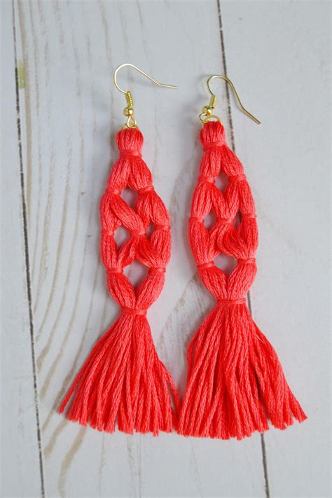 Place the top of the second tassel on top of the tassel and allow to cool. Coral Tassel Earrings | FaveCrafts.com