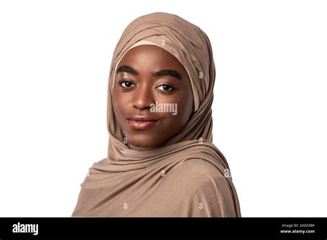 Portrait Of Modest Black Muslim Lady In Hijab Looking And Posing At Camera Standing Isolated