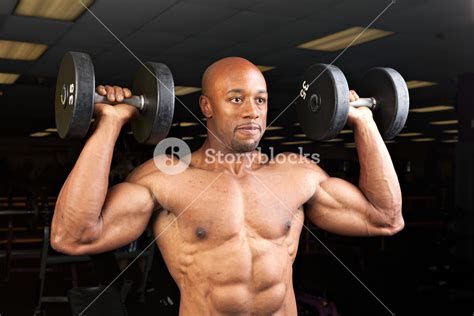 Toned And Ripped Lean Muscle Fitness Man Lifting Weights Royalty Free