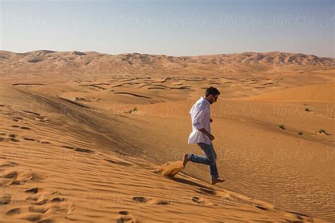 Man Walking Alone In The Desert By Stocksy Contributor Mauro