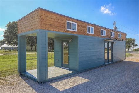 Tiny Container House With A Covered Deck And A Cozy Loft Bedroom